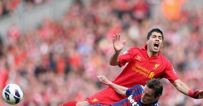 Suarez: Tackled by Whitehead